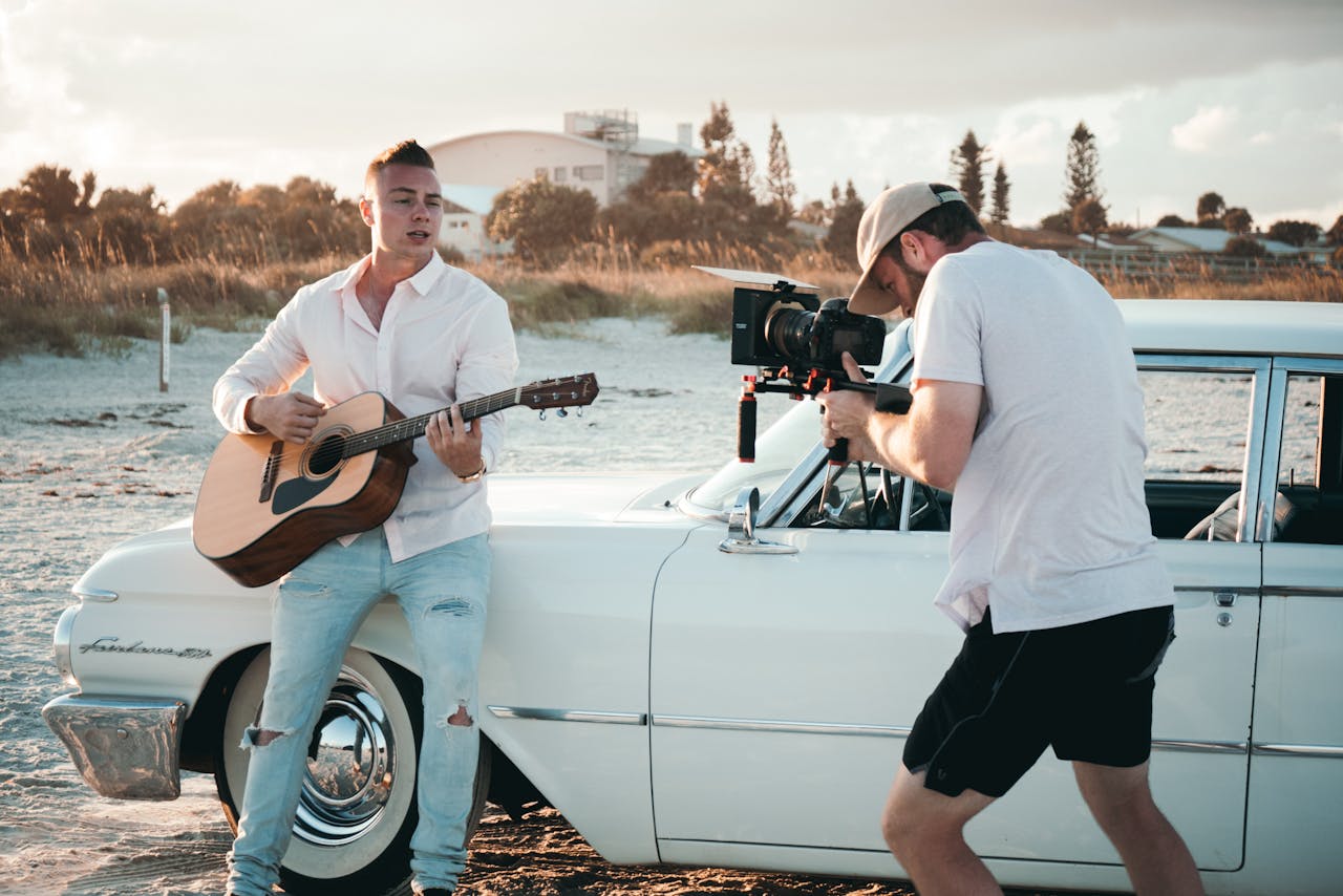 Photo Of Man Playing Guitar