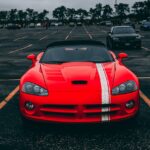 Red Convertible Coupe on Black Surface